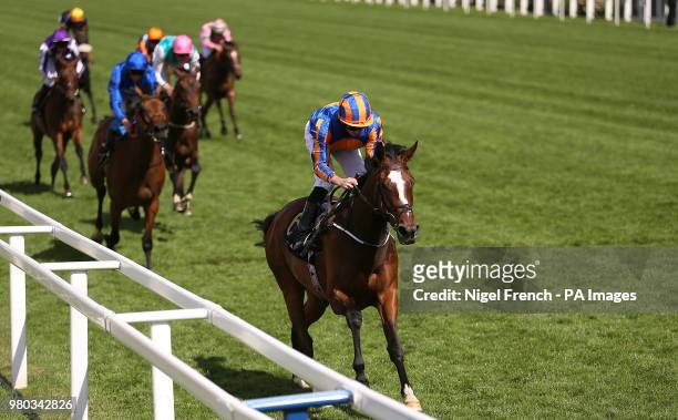 Jockey Ryan Moore on board Magic Wand wins the Ribblesdale Stakes during day three of Royal Ascot at Ascot Racecourse.