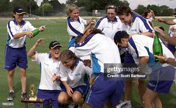 The NSWIS Blues team celebrate after recieving the trophy after defeating Queensland in game two to win the Women's National Cricket League Final...