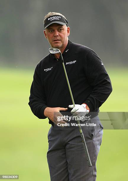 Darren Clarke of Nothern Ireland chips onto the 13th green during the first round of the Open de Andalucia 2010 at Parador de Malaga Golf on March...