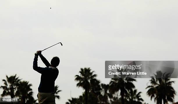 Joost Luiten of Holland plays his second shot into the 18th green during the first round of the Open de Andalucia 2010 at Parador de Malaga Golf on...