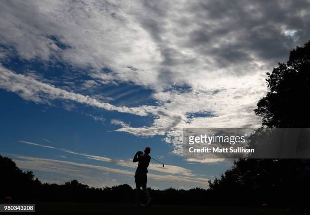 Russell Henley of the United States plays his shot from the 11th tee during the first round of the Travelers Championship at TPC River Highlands on...
