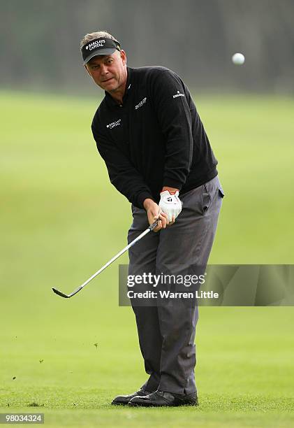 Darren Clarke of Nothern Ireland chips onto the 13th green during the first round of the Open de Andalucia 2010 at Parador de Malaga Golf on March...