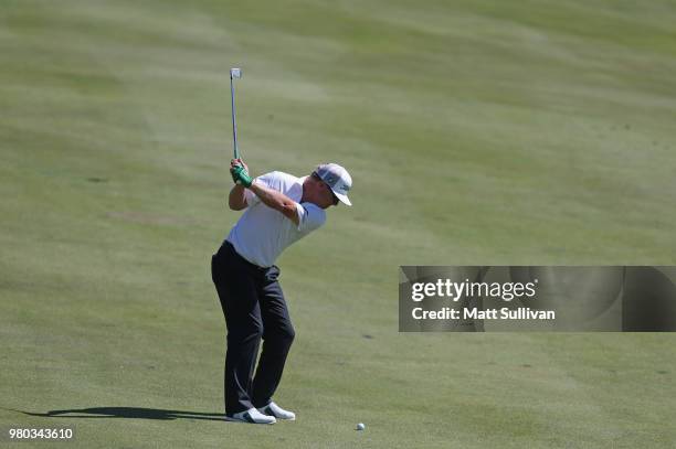 Charley Hoffman of the United States plays a shot on the 17th hole during the first round of the Travelers Championship at TPC River Highlands on...