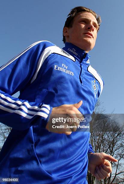 Marcell Jansen of Hamburg runs during the Hamburger SV training session at the HSH Nordbank Arena on March 25, 2010 in Hamburg, Germany.