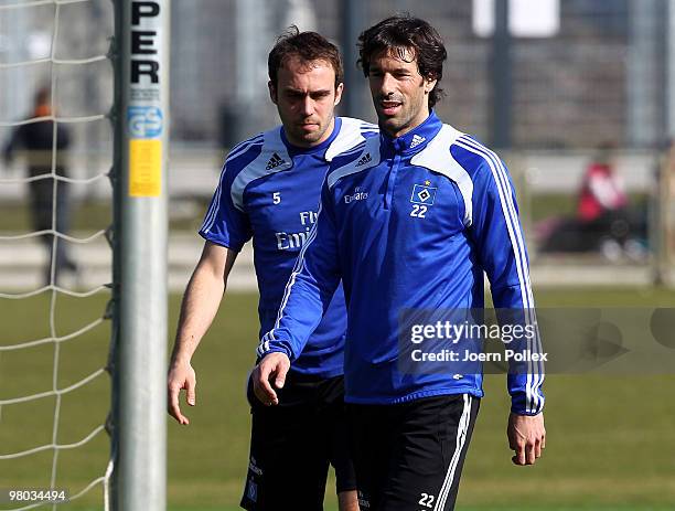 Joris Mathijsen and Ruud van Nistelrooy of Hamburg are seen during the Hamburger SV training session at the HSH Nordbank Arena on March 25, 2010 in...