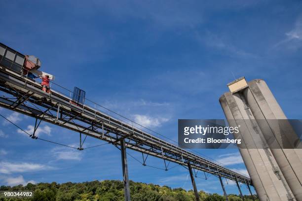 Worker replaces a silo conveyor filter at the Lecureur SA cereal plant in the Port of Rouen, in Val de la Haye, France, on Thursday, June 21, 2018....