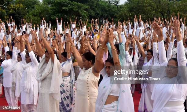 Members of Brahma Kumaris participate in a yoga session on the occasion of the 4th International Day of Yoga, at Sradhanjali Kanan on June 21, 2018...