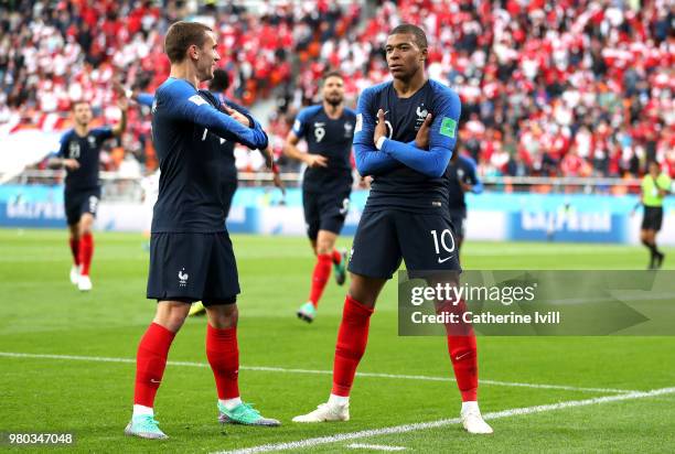 Kylian Mbappe of France celebrates with teammate Antoine Griezmann after scoring his team's first goal during the 2018 FIFA World Cup Russia group C...
