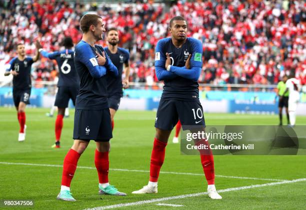 Kylian Mbappe of France celebrates with teammate Antoine Griezmann after scoring his team's first goal during the 2018 FIFA World Cup Russia group C...