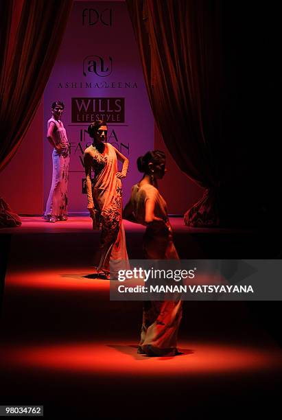 Models present creations by Indian designers Ashima-Leena during the Wills India Fashion Week Autumn-Winter 2010 in New Delhi on March 25, 2010....