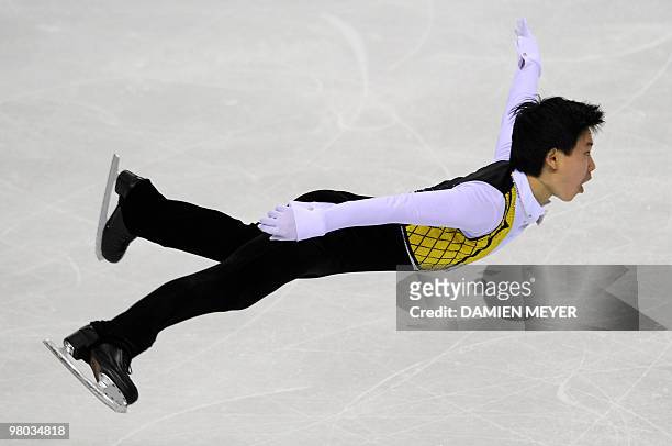 Kazakh's Denis Ten performs Men's short program of the World Figure Skating Championships on March 24, 2010 at the Palavela ice-rink in Turin. AFP...