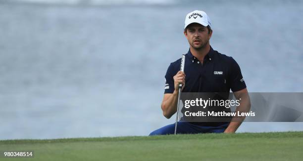 Sebastien Gros of France lines up a putt on the 17th green during day one of the BMW International Open at Golf Club Gut Larchenhof on June 21, 2018...