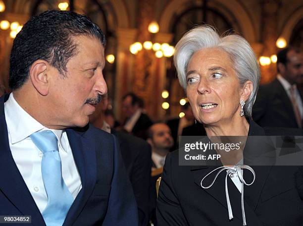 French Finance Minister Christine Lagarde listens to her Qatari counterpart Yussef Hussein Kamal during the 5th Finance and investment in Qatar Forum...