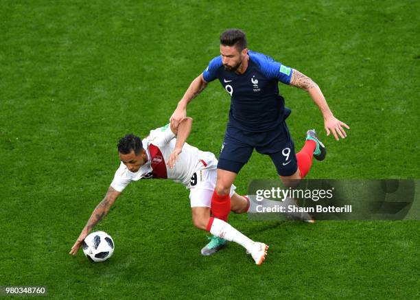 Olivier Giroud of France is challenged by Yoshimar Yotun of Peru during the 2018 FIFA World Cup Russia group C match between France and Peru at...