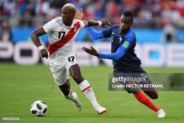 Peru's defender Luis Advincula and France's midfielder Blaise Matuidi compete for the ball during the Russia 2018 World Cup Group C football match...