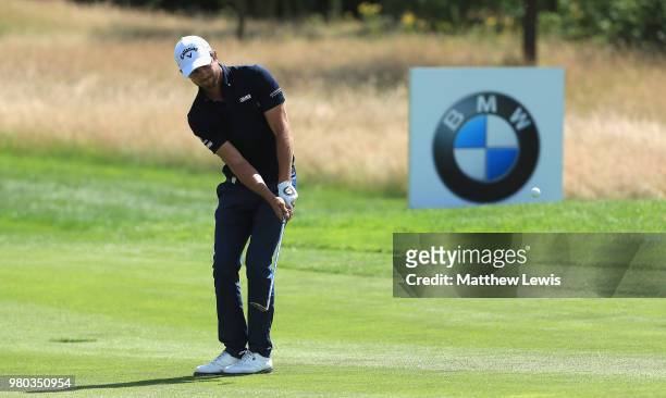 Sebastien Gros of France chips onto the 12th green during day one of the BMW International Open at Golf Club Gut Larchenhof on June 21, 2018 in...