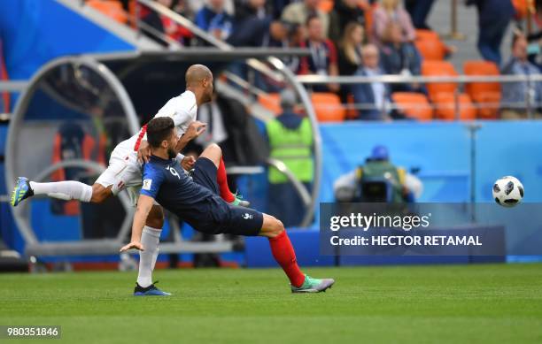 France's forward Olivier Giroud and Peru's defender Alberto Rodriguez compete for the ball during the Russia 2018 World Cup Group C football match...