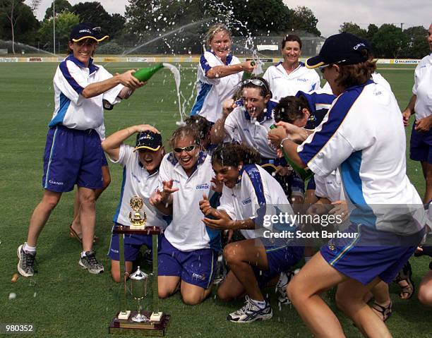 The NSWIS Blues team celebrate after recieving the trophy after defeating Queensland in game two to win the Women's National Cricket League Final...