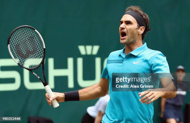 Roger Federer of Switzerland celebrates after defeating Benoit Paire of France during their round of 16 match on day 4 of the Gerry Weber Open at...