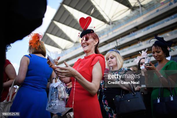 Racegoer collects her winnings during Royal Ascot Day 3 at Ascot Racecourse on June 21, 2018 in Ascot, United Kingdom. Royal Ascot is Britain's most...