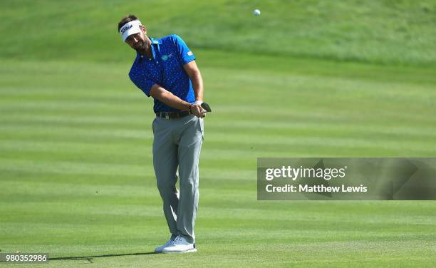 Scott Jamieson of Scotland chips onto the 12th green during day one of the BMW International Open at Golf Club Gut Larchenhof on June 21, 2018 in...