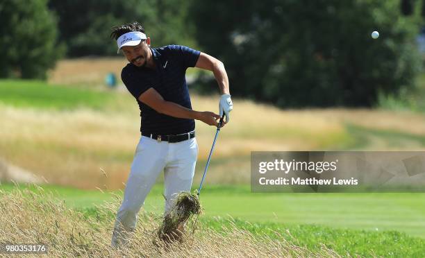 Mike Lorenzo-Vera of France plays out of the rough on the 12th hole during day one of the BMW International Open at Golf Club Gut Larchenhof on June...