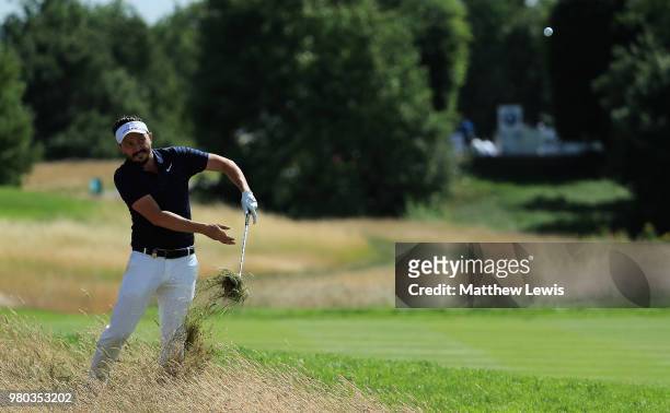 Mike Lorenzo-Vera of France plays out of the rough on the 12th hole during day one of the BMW International Open at Golf Club Gut Larchenhof on June...