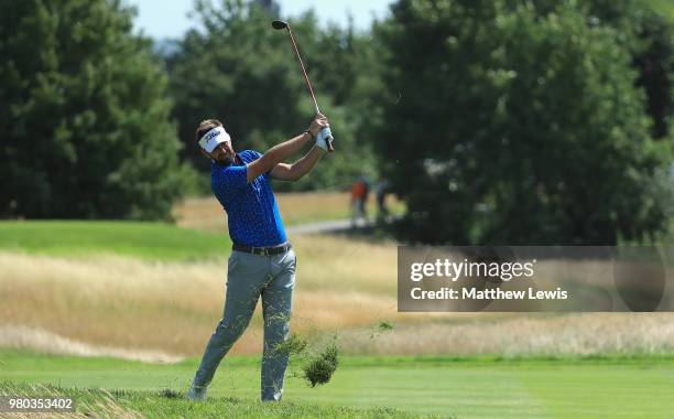 Scott Jamieson of Scotland plays out of the rough on the 12th hole during day one of the BMW International Open at Golf Club Gut Larchenhof on June...