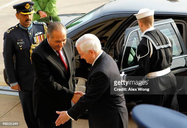 Secretary of Defense Robert Gates shakes hands with Pakistani Minister of Defense Chaudhry Ahmed Mukhtar during an honor cordon as Mukhtar arrives...