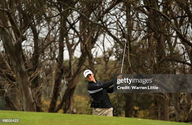 Sam Hutsby of England plays his second shot into the 18th green during the first round of the Open de Andalucia 2010 at Parador de Malaga Golf on...