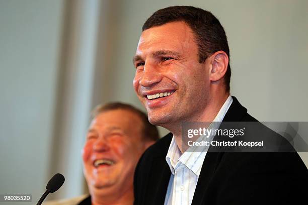 Vitali Klitschko of Ukraine and his coach Fritz Sdunek attend a press conference at Veltins Arena on March 25, 2010 in Gelsenkirchen, Germany. The...