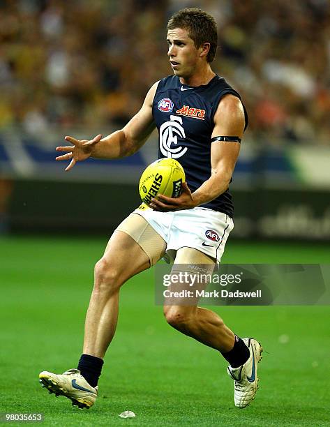 Marc Murphy of the Blues gathers the ball during the round one AFL match between the Richmond Tigers and Carlton Blues at Melbourne Cricket Ground on...