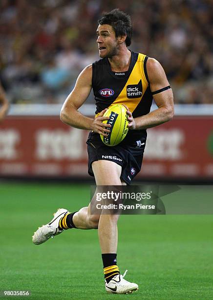 Chris Newman of the Tigers in action during the round one AFL match between the Richmond Tigers and Carlton Blues at the Melbourne Cricket Ground on...