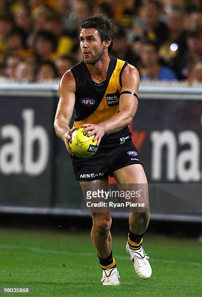 Chris Newman of the Tigers in action during the round one AFL match between the Richmond Tigers and Carlton Blues at the Melbourne Cricket Ground on...