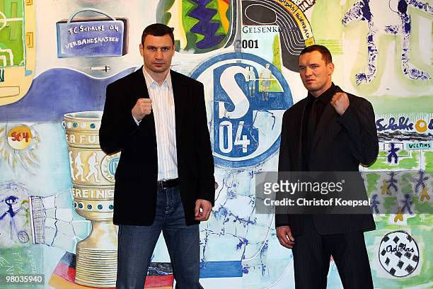 Vitali Klitschko of Ukraine poses with Albert Sosnowski of Poland gives an interview the Schalke museum before the press conference at Veltins Arena...
