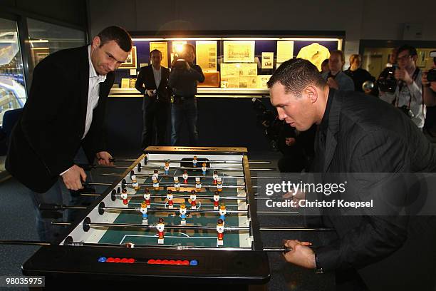 Vitali Klitschko of Ukraine and his opponent Albert Sosnowski of Poland polay kicker in the Schalke museum before the press conference at Veltins...