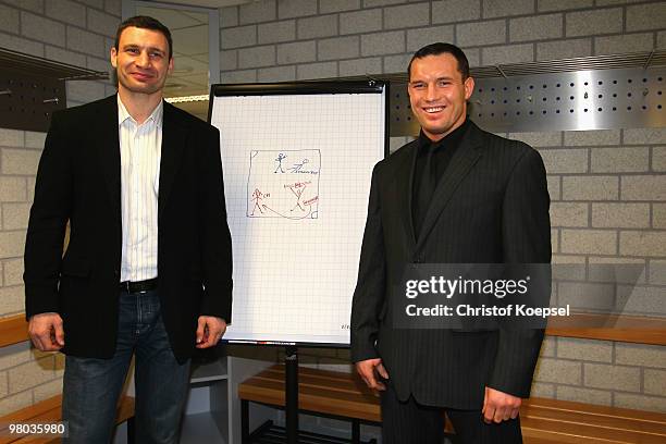 Vitali Klitschko of Ukraine and his opponent Albert Sosnowski of Poland pose in the Schalke cabin before the press conference at Veltins Arena on...