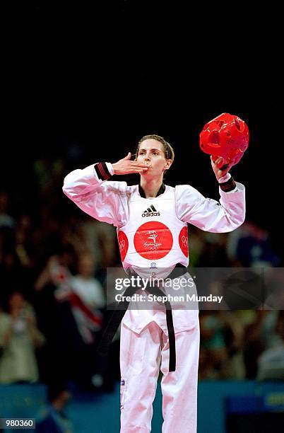 Lauren Burns of Australia celebrates after defeating Urbia Melendez Rodriguez of Cuba for the gold medal in the Women's 49kg Taekwondo Final held at...
