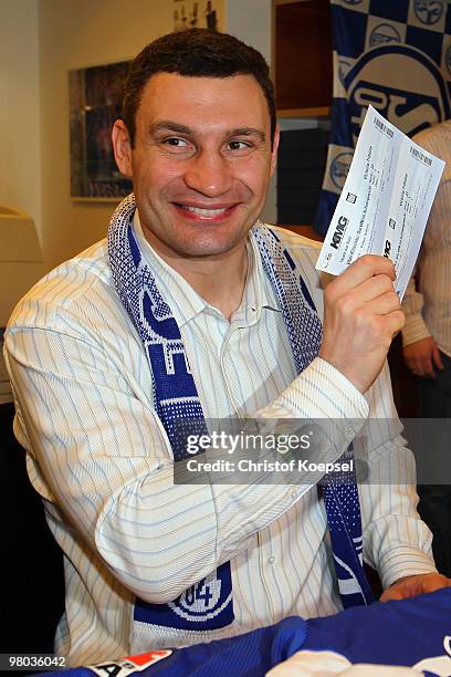 Vitali Klitschko of Ukraine sells tickets in the ticket shop before the press conference at Veltins Arena on March 25, 2010 in Gelsenkirchen,...