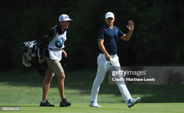 Christiaan Bezuidenhout of South Africa looks on with his caddie during day one of the BMW International Open at Golf Club Gut Larchenhof on June 21,...