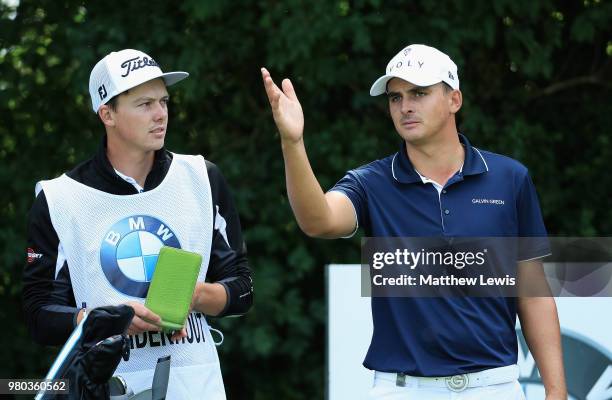 Christiaan Bezuidenhout of South Africa looks on with his caddie during day one of the BMW International Open at Golf Club Gut Larchenhof on June 21,...