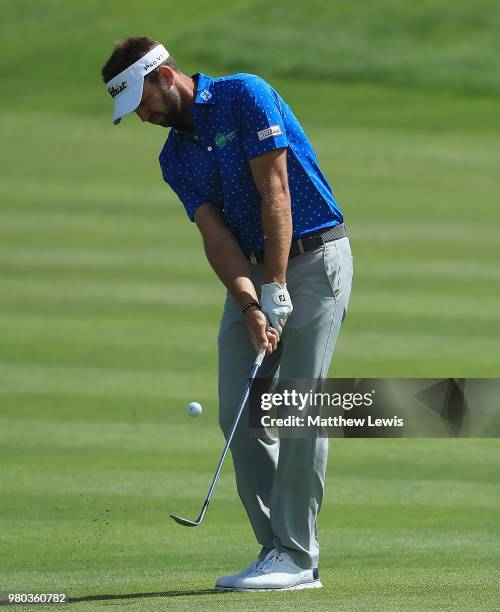 Scott Jamieson of Scotland chips onto the 12th green during day one of the BMW International Open at Golf Club Gut Larchenhof on June 21, 2018 in...