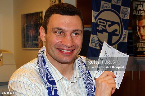 Vitali Klitschko of Ukraine sells tickets in the ticket shop before the press conference at Veltins Arena on March 25, 2010 in Gelsenkirchen,...