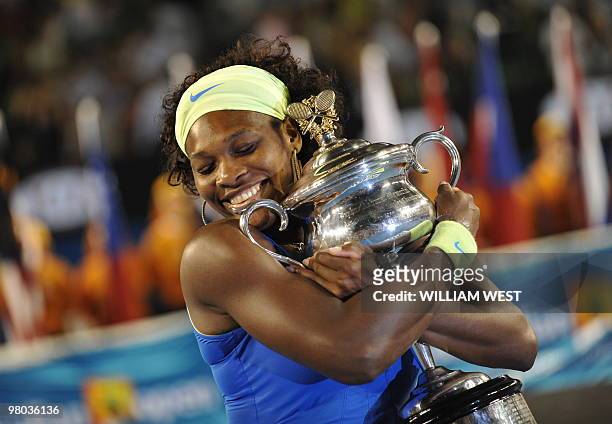 Serena Wiliams of the US holds the winners trophy after her game against Dinara Safina of Russia in their women's tennis finals match on day 13 of...