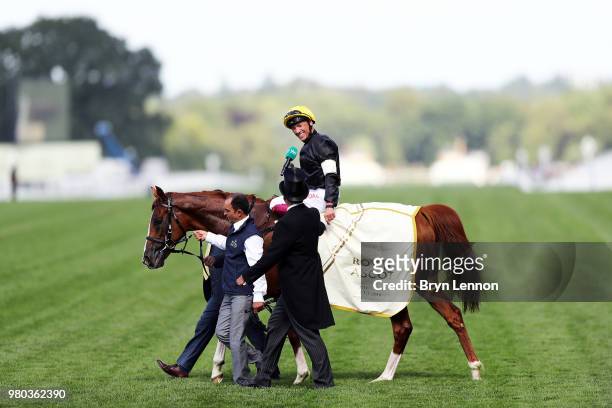 Frankie Dettori riding Stradivarius is interviewed after winning The Gold Cup as he crosses the line on day 3 of Royal Ascot at Ascot Racecourse on...