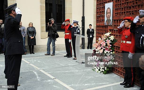 French and Basque regional police members salute during a homage to Serge Nerin, at the Basque regional parliament in Vitoria, North of Spain, on...