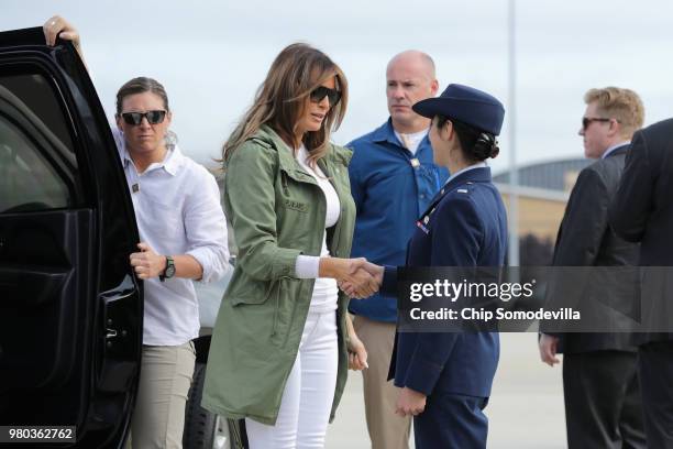 First lady Melania Trump steps out of her motorcade before boarding an Air Force plane and traveling to Texas to visit facilities that house and care...