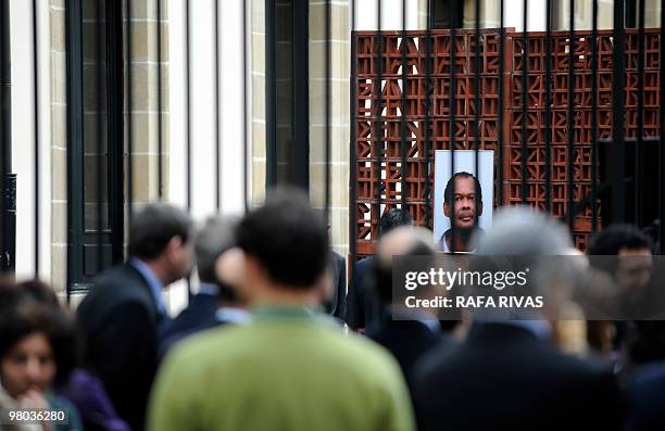 Basque Parliament representatives protest against killing of Serge Nerin, at the Basque regional parliament in Vitoria, northern Spain, on March 25,...