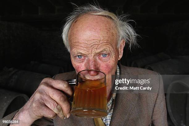 Frank Naish, Britain's oldest cider maker samples some of the cider he pressed this year at his farm in West Pernard near Pilton on March 25, 2010 in...