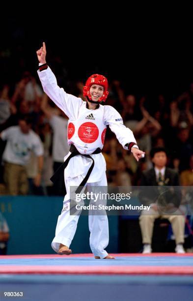 Lauren Burns of Australia celebrates after defeating Urbia Melendez Rodriguez of Cuba for the gold medal in the Women's 49kg Taekwondo Final held at...